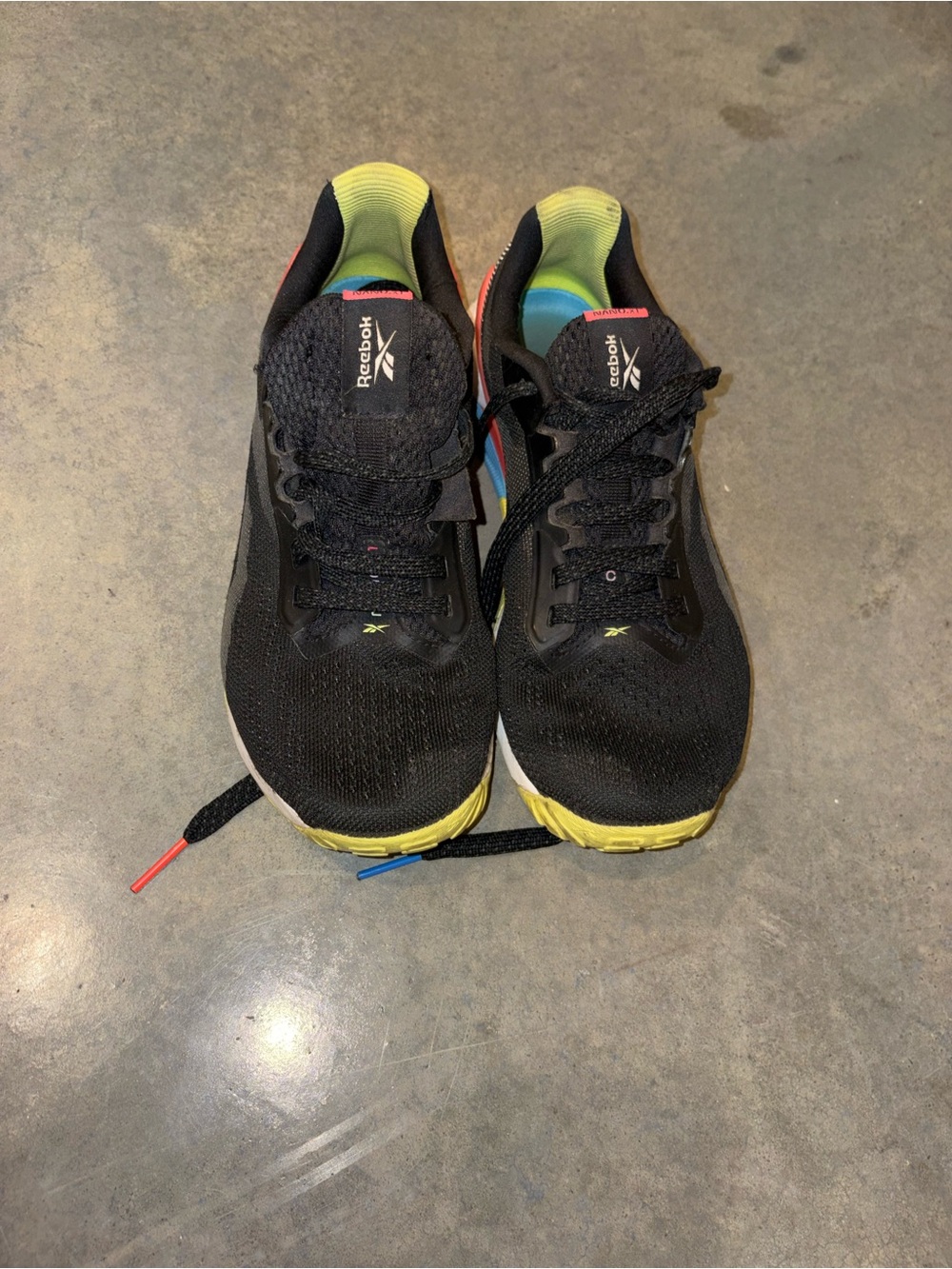 Reebok Men's Black Athletic Shoes with Yellow and Blue Accents